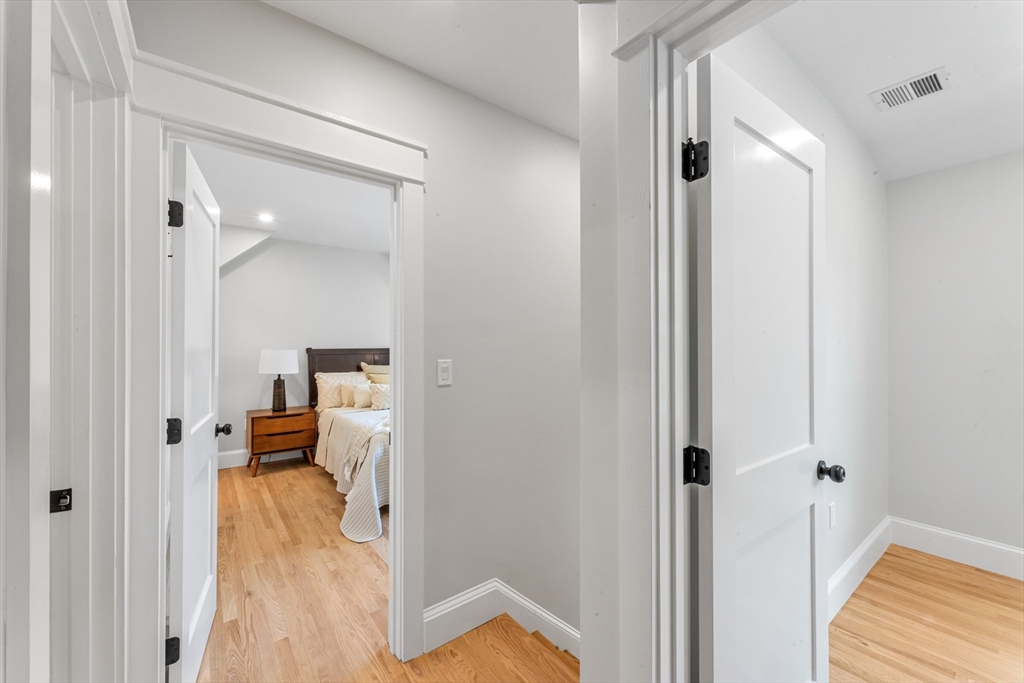 180 Dent Street Boston, MA 02132 - Photo 17 of 30 a view of a bedroom from a hallway
