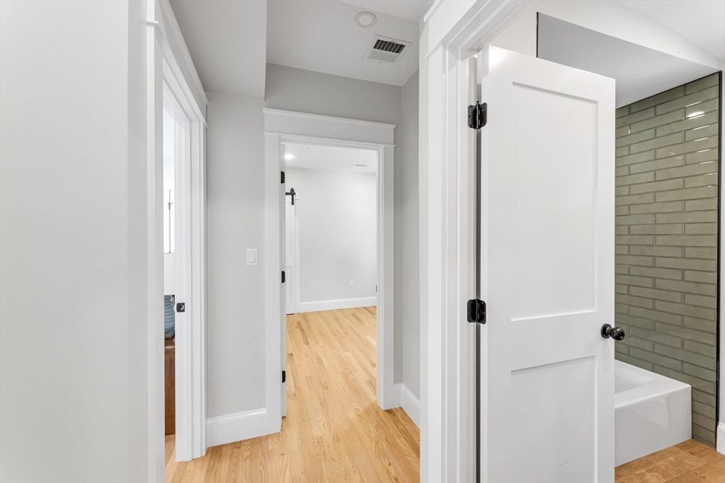 180 Dent Street Boston, MA 02132 - Photo 18 of 30 a view of a bathroom with a tub and shower