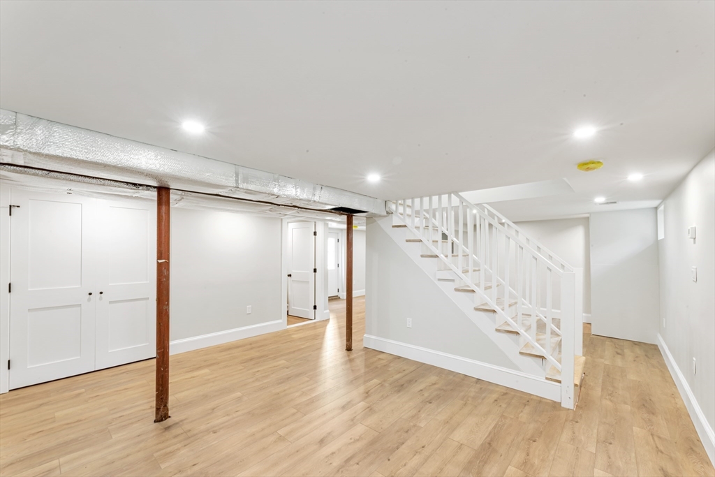 180 Dent Street Boston, MA 02132 - Photo 21 of 30 a view of an empty room with wooden floor