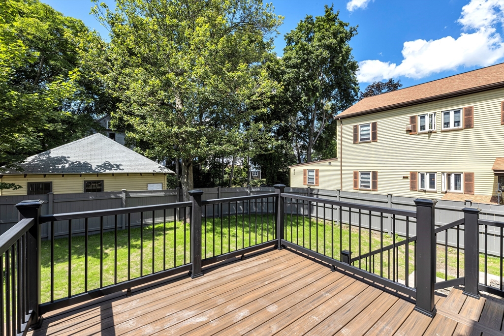 180 Dent Street Boston, MA 02132 - Photo 27 of 30 a view of a wooden deck with large trees