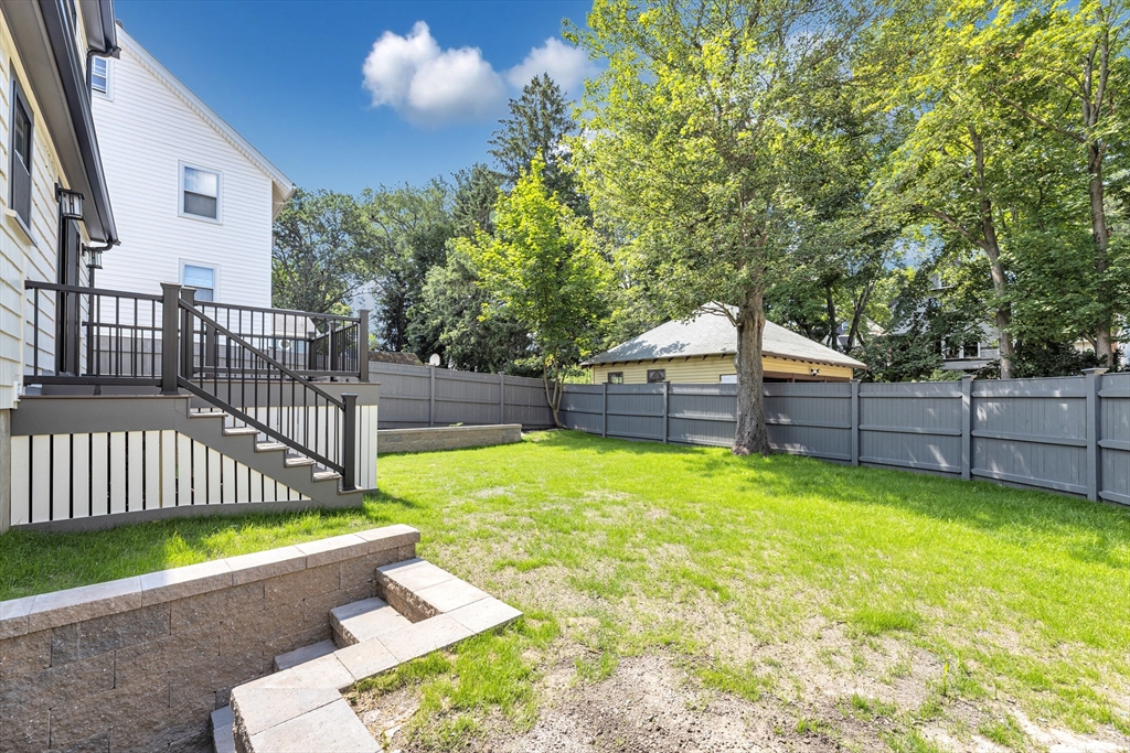 180 Dent Street Boston, MA 02132 - Photo 29 of 30 a view of a backyard with wooden fence