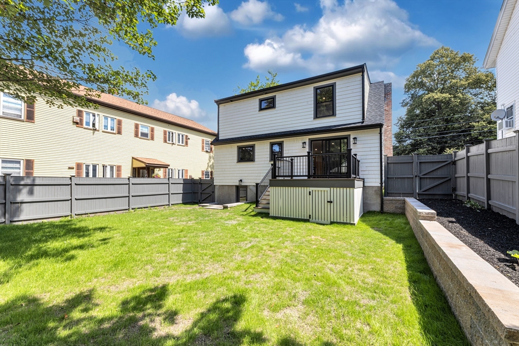 180 Dent Street Boston, MA 02132 - Photo 30 of 30 a view of a house with backyard and a tree