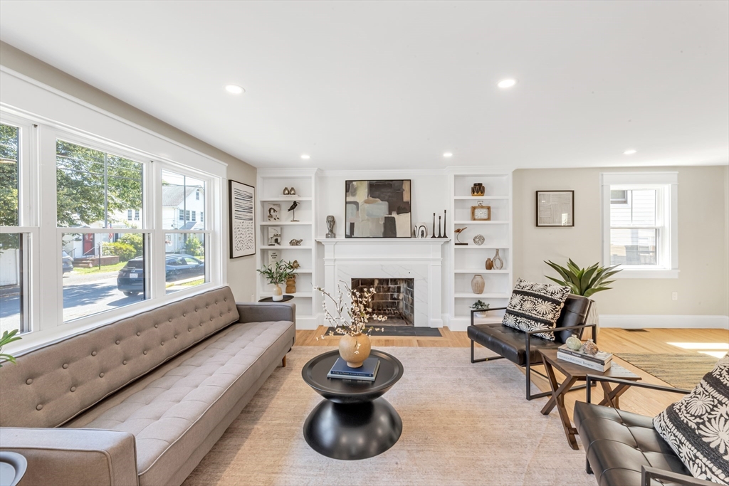 180 Dent Street Boston, MA 02132 - Photo 5 of 30 a living room with furniture and a fireplace