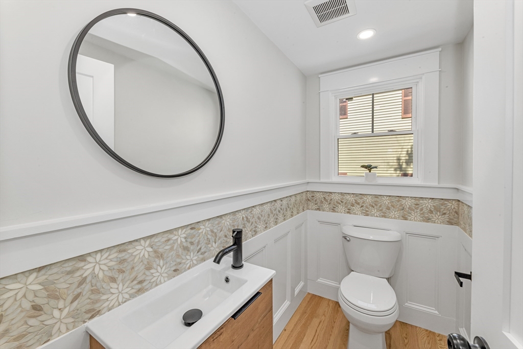 180 Dent Street Boston, MA 02132 - Photo 8 of 30 a bathroom with a sink mirror and toilet