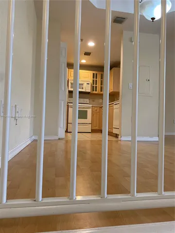 a view of balcony with furniture