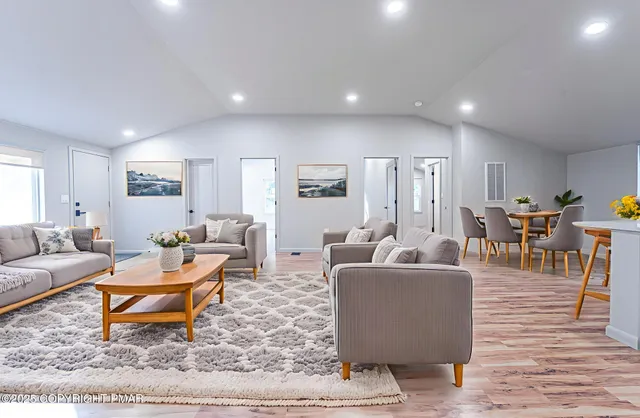 a living room with furniture and a rug