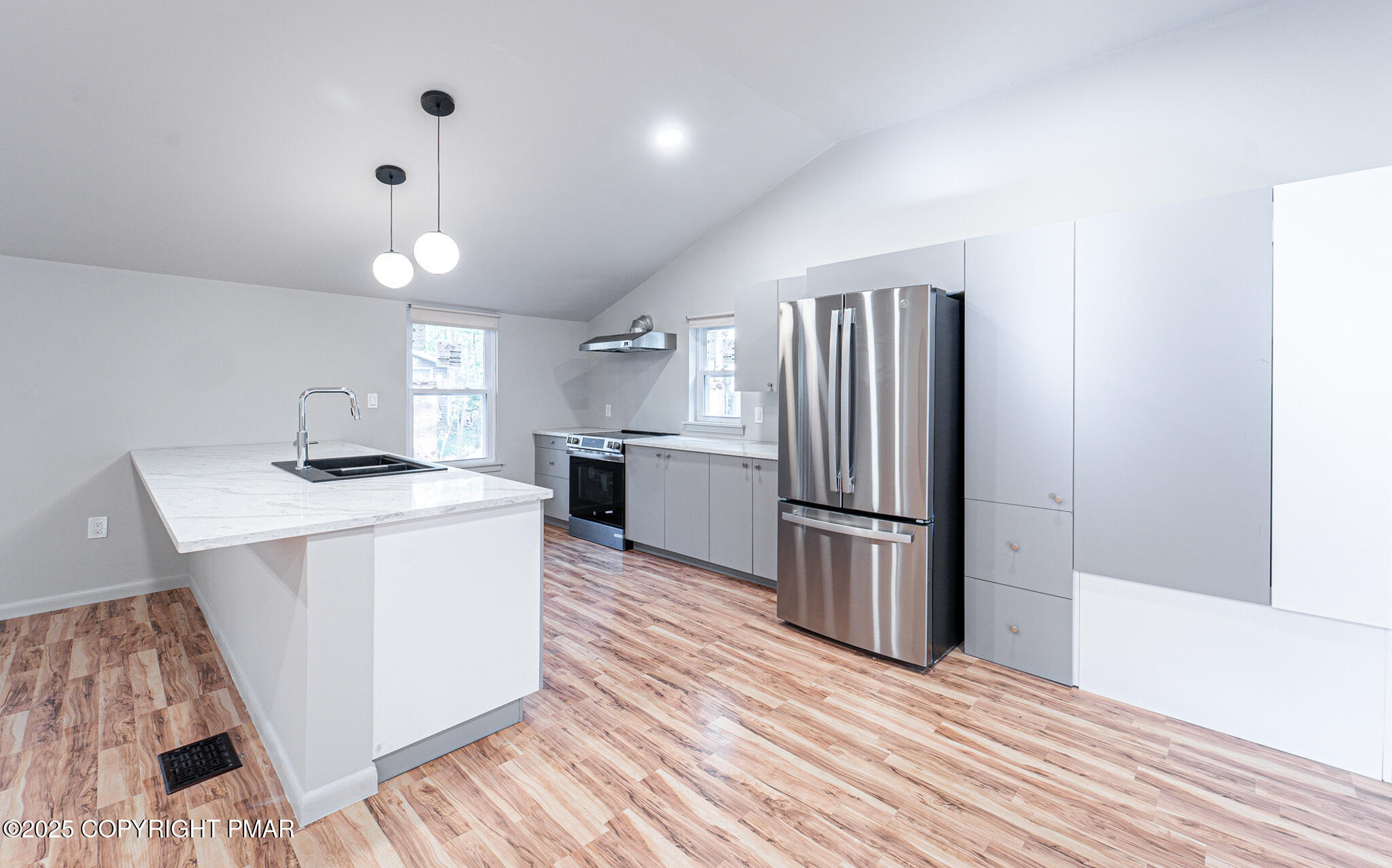 113 Netcong Circle Pocono Lake, PA 18347 - Photo 18 of 51 a kitchen with kitchen island a sink and a refrigerator