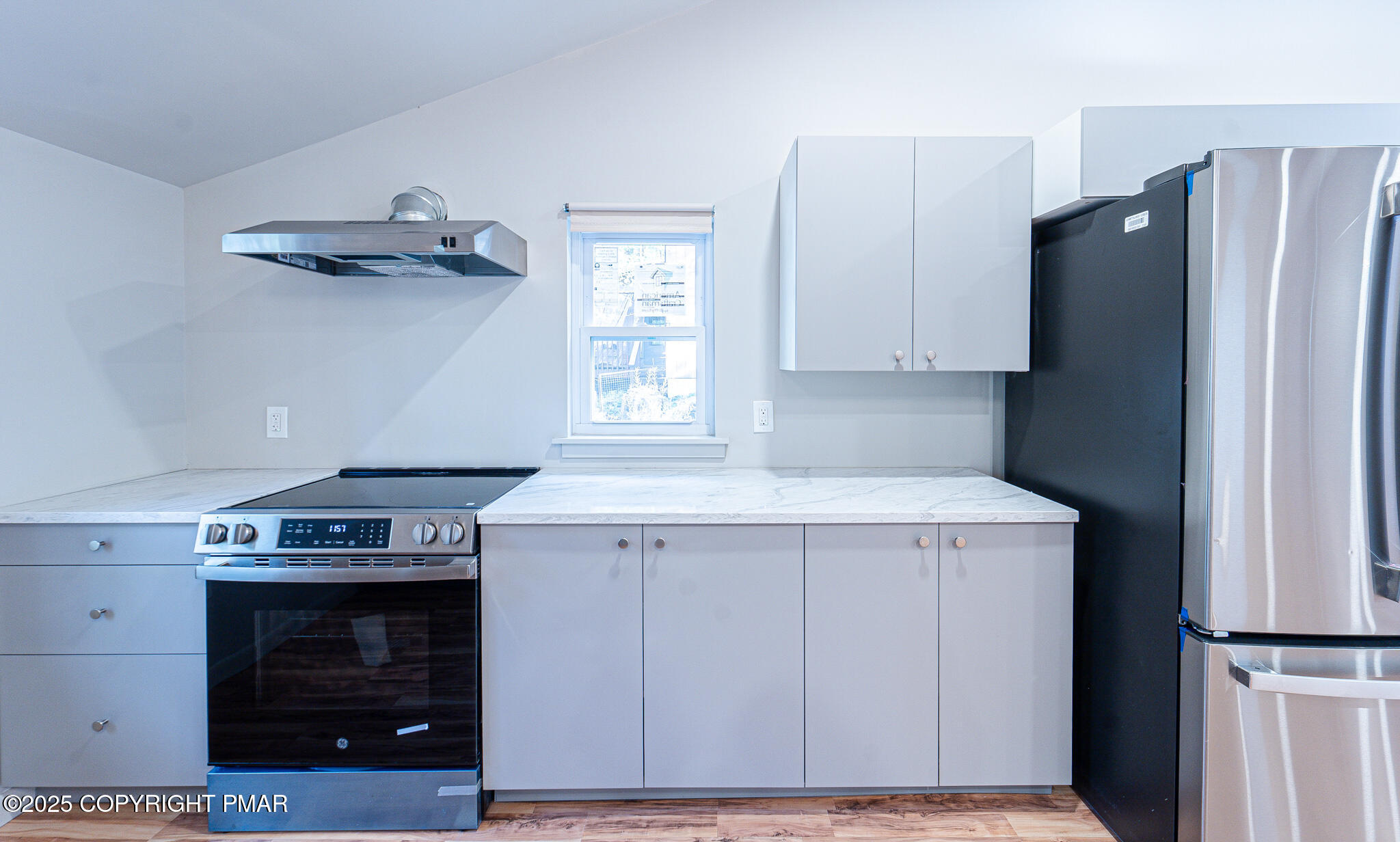 113 Netcong Circle Pocono Lake, PA 18347 - Photo 20 of 51 a kitchen with a stove and a refrigerator