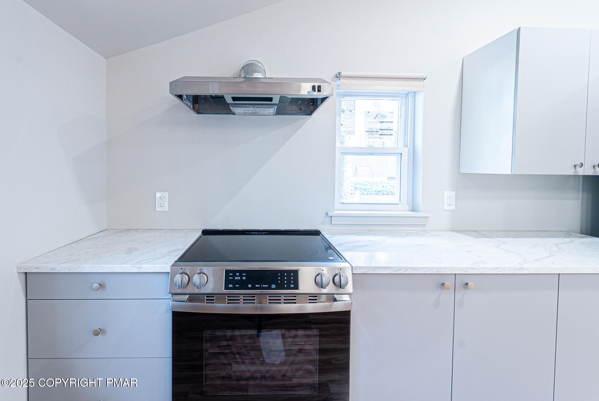 113 Netcong Circle Pocono Lake, PA 18347 - Photo 21 of 51 a kitchen with a stove and a more cabinets