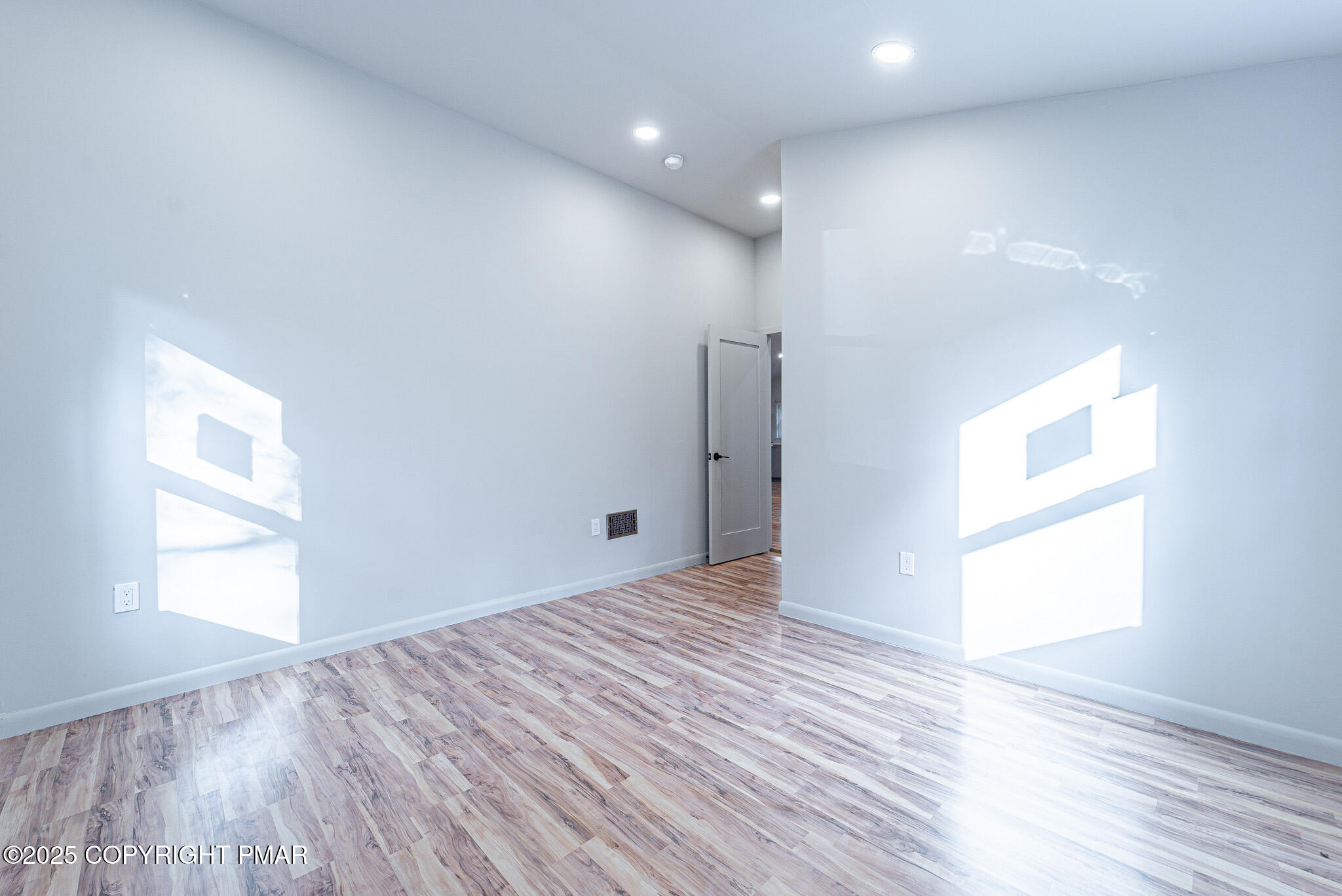 113 Netcong Circle Pocono Lake, PA 18347 - Photo 35 of 51 a view of an empty room with wooden floor and a window