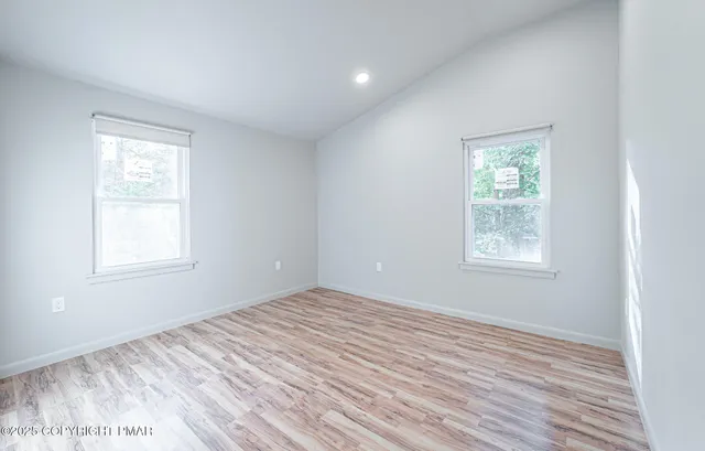 a view of a room that has a window in it