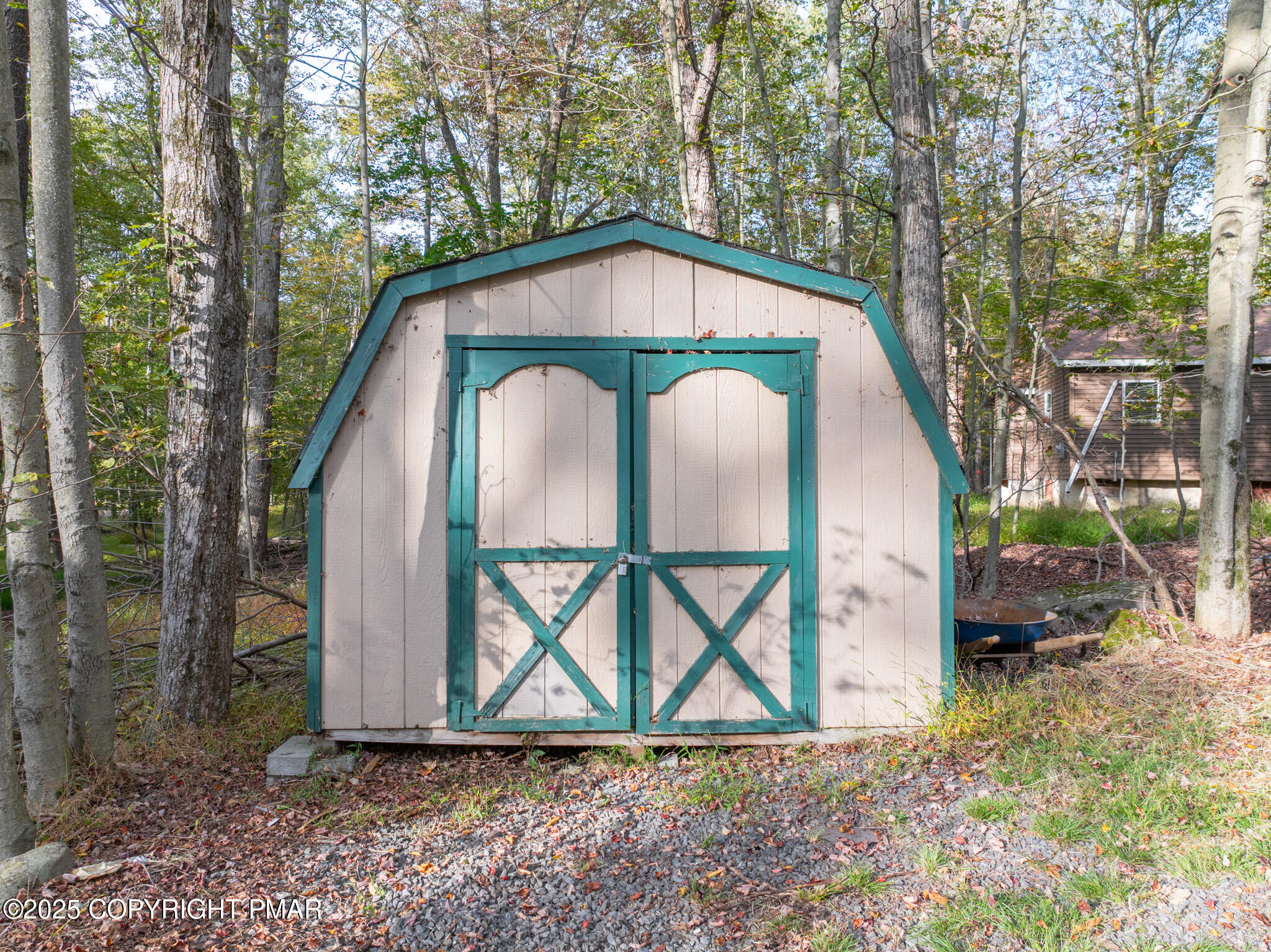 113 Netcong Circle Pocono Lake, PA 18347 - Photo 41 of 51 a view of backyard with a barn and a table and chairs