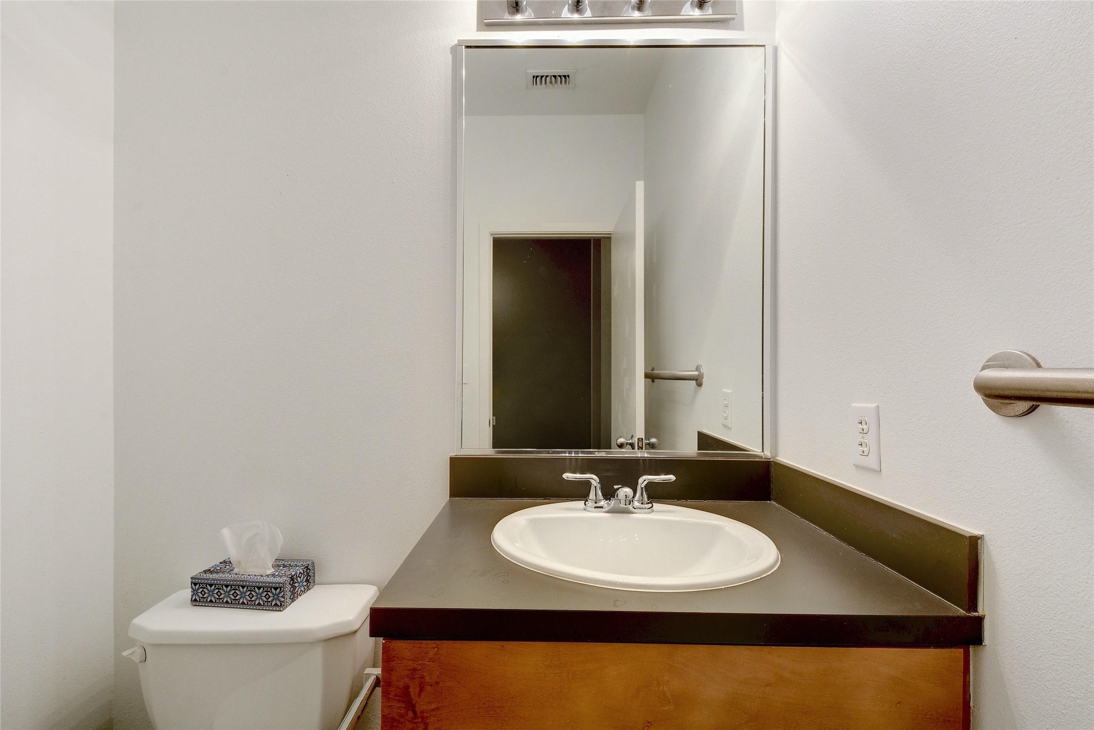 2401 East 6th Street, Unit 41 Austin, TX 78702 - Photo 11 of 23 a bathroom with a sink and a toilet