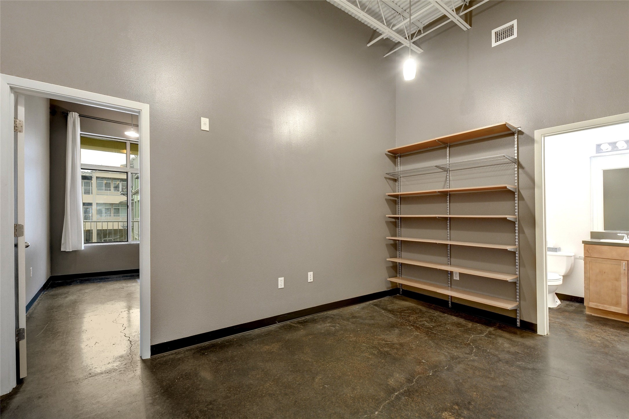 2401 East 6th Street, Unit 41 Austin, TX 78702 - Photo 12 of 23 a view of an empty room and a window