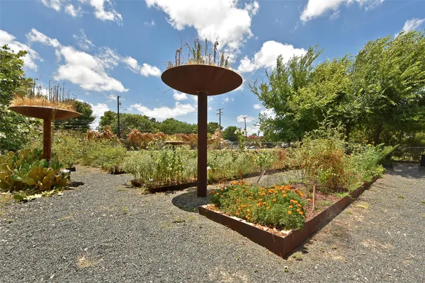 a backyard of a house with barbeque oven