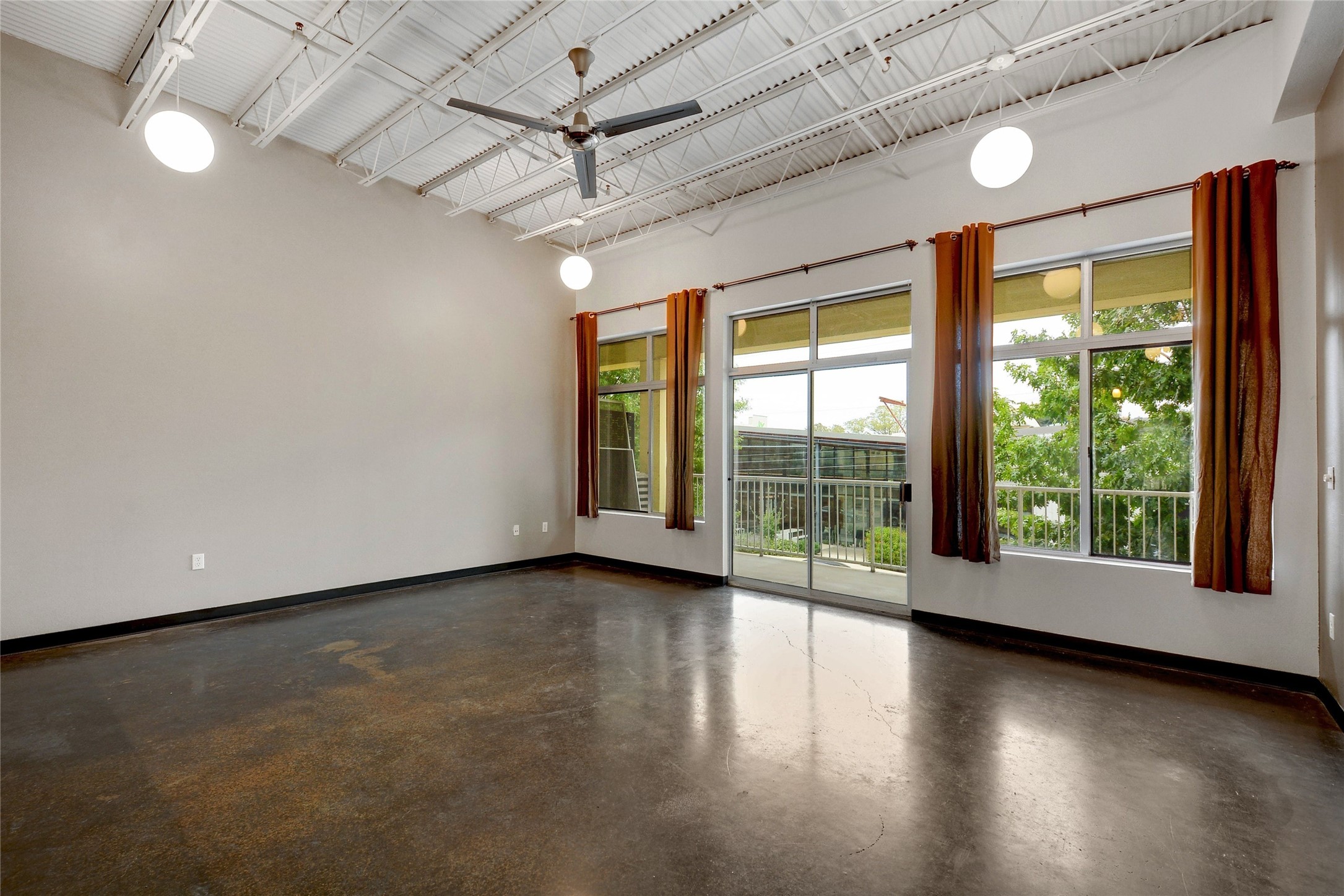 2401 East 6th Street, Unit 41 Austin, TX 78702 - Photo 3 of 23 an empty room with wooden floor and windows