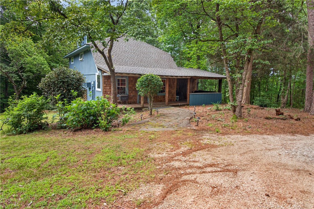 A secluded retreat nestled in a wooded setting, offering a private, tranquil living experience.