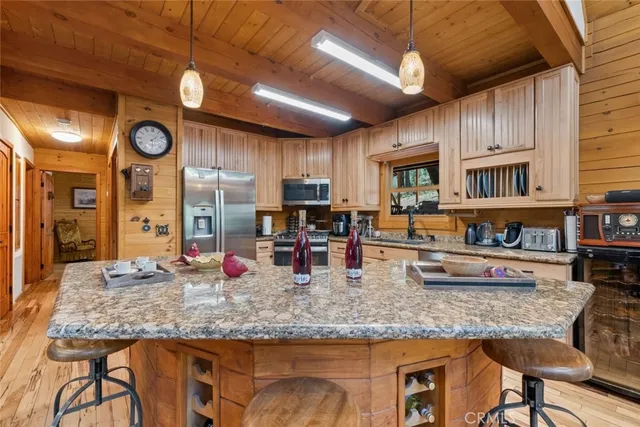 a bathroom with a granite countertop sink and a