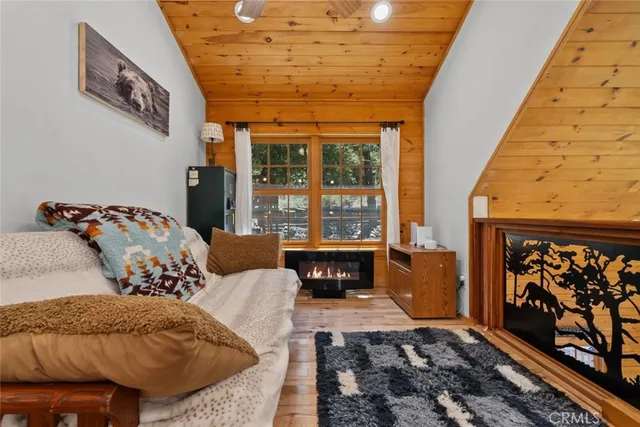 a living room with furniture gym equipment and a fireplace