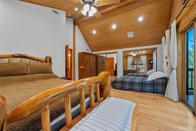 a bathroom with a double vanity sink a toilet and shower