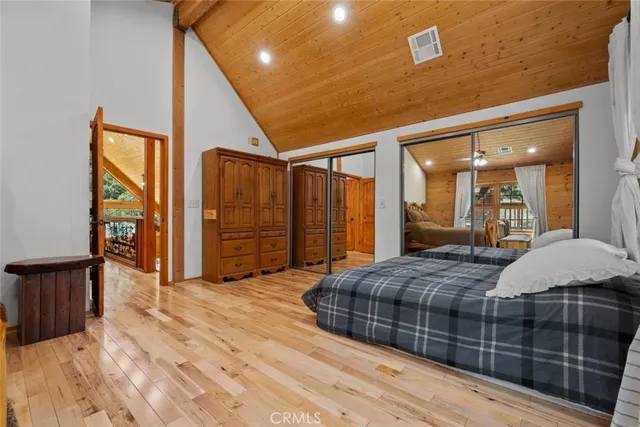 a bathroom with a granite countertop sink mirror vanity and toilet