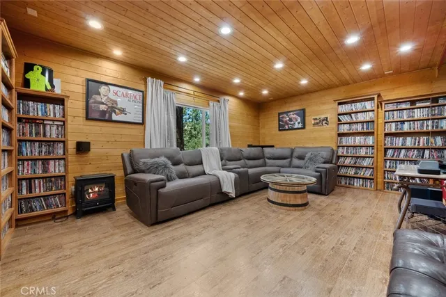 a view of a deck with two chairs and wooden floor