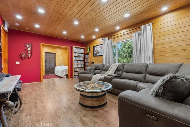 a view of a patio with table and chairs with wooden floor and fence