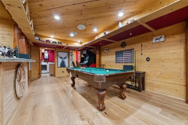 an aerial view of residential house with outdoor space and trees all around