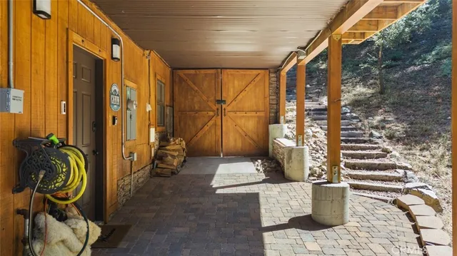 a living room with patio furniture and a fountain
