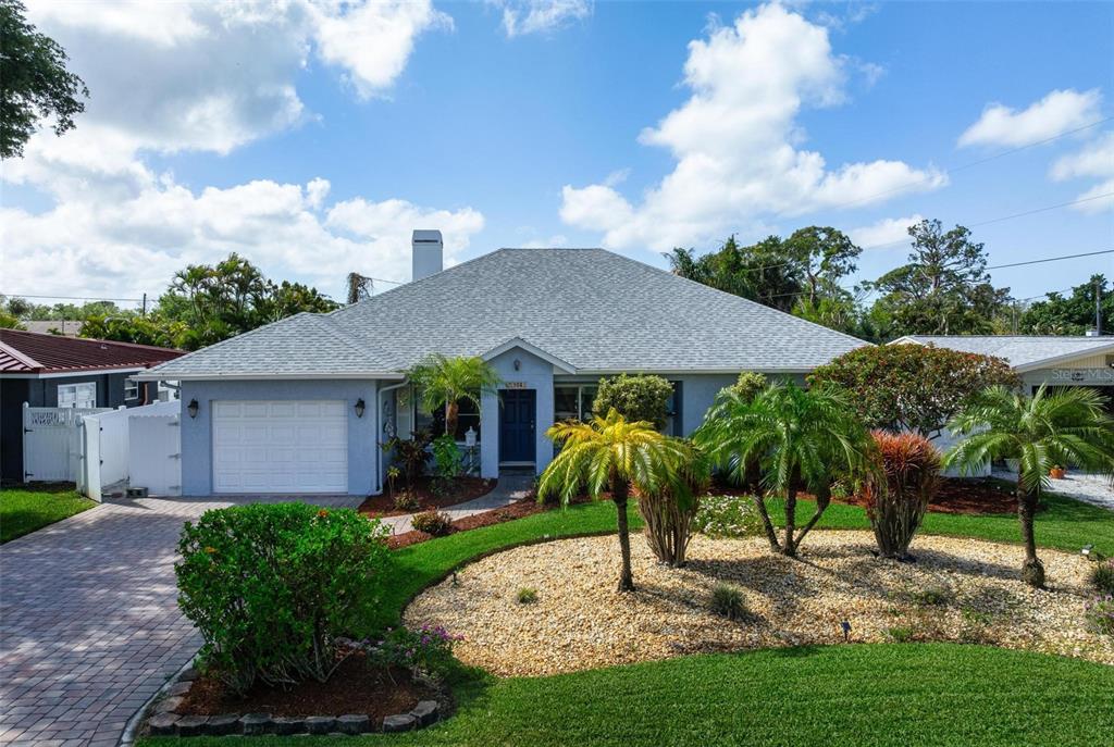 104 Alba Street West Venice, FL 34285 - Photo 1 of 42 a view of a house with a yard and table plants and large tree