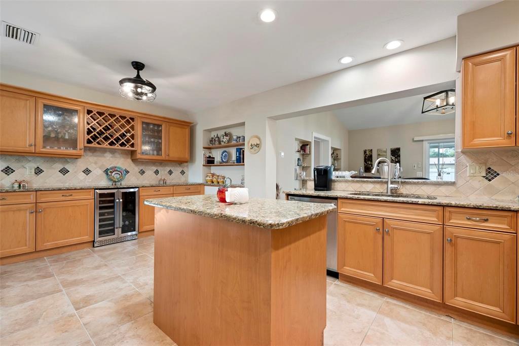 104 Alba Street West Venice, FL 34285 - Photo 17 of 42 a kitchen with stainless steel appliances granite countertop a stove and a sink