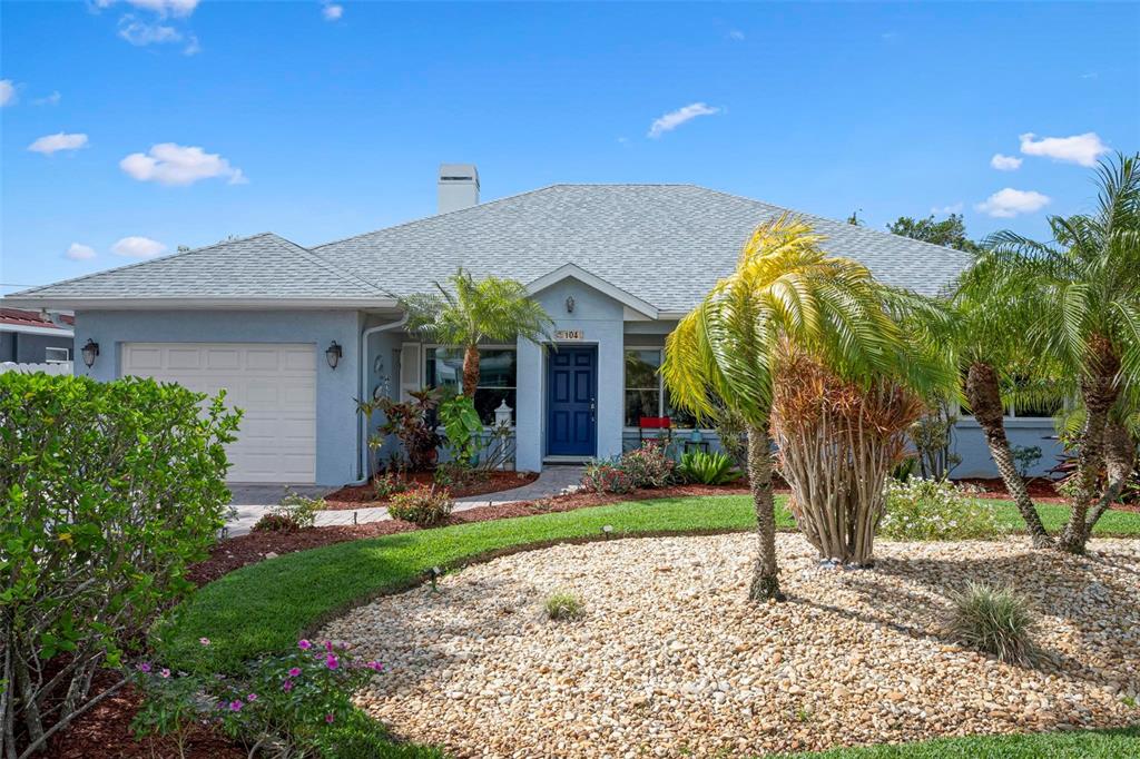 104 Alba Street West Venice, FL 34285 - Photo 2 of 42 a front view of a house with garden