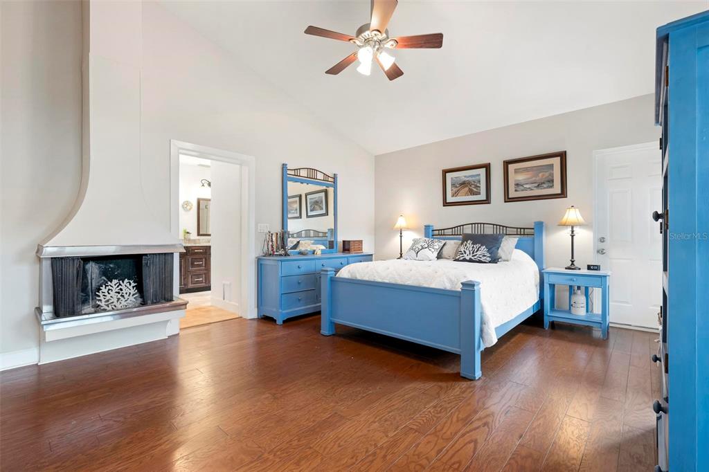 104 Alba Street West Venice, FL 34285 - Photo 21 of 42 a bedroom with a bed and a fireplace