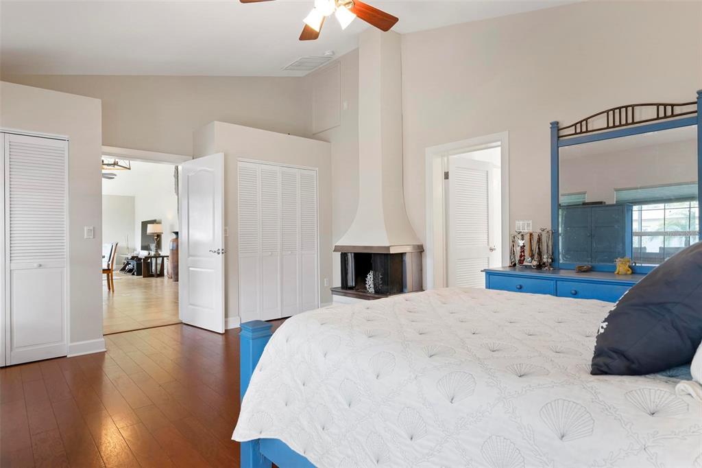 104 Alba Street West Venice, FL 34285 - Photo 23 of 42 a large bedroom with a bed and wooden floor