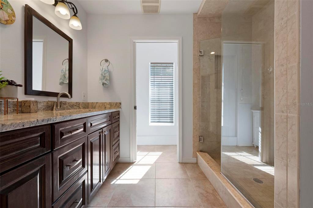 104 Alba Street West Venice, FL 34285 - Photo 26 of 42 a bathroom with a sink a vanity and a mirror
