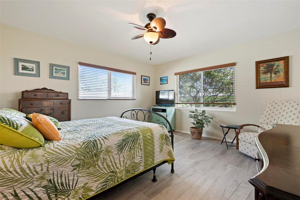 104 Alba Street West Venice, FL 34285 - Photo 27 of 42 a bedroom with a bed and wooden floor
