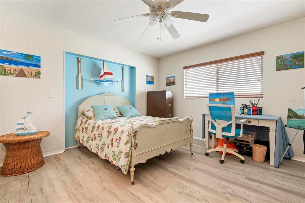104 Alba Street West Venice, FL 34285 - Photo 30 of 42 a bed room with a bed and a chair