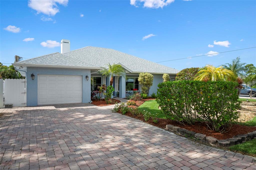 104 Alba Street West Venice, FL 34285 - Photo 3 of 42 a front view of a house with garden