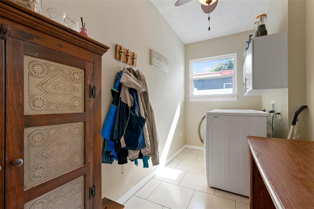 104 Alba Street West Venice, FL 34285 - Photo 34 of 42 a view of walk in closet with clothes and shoes