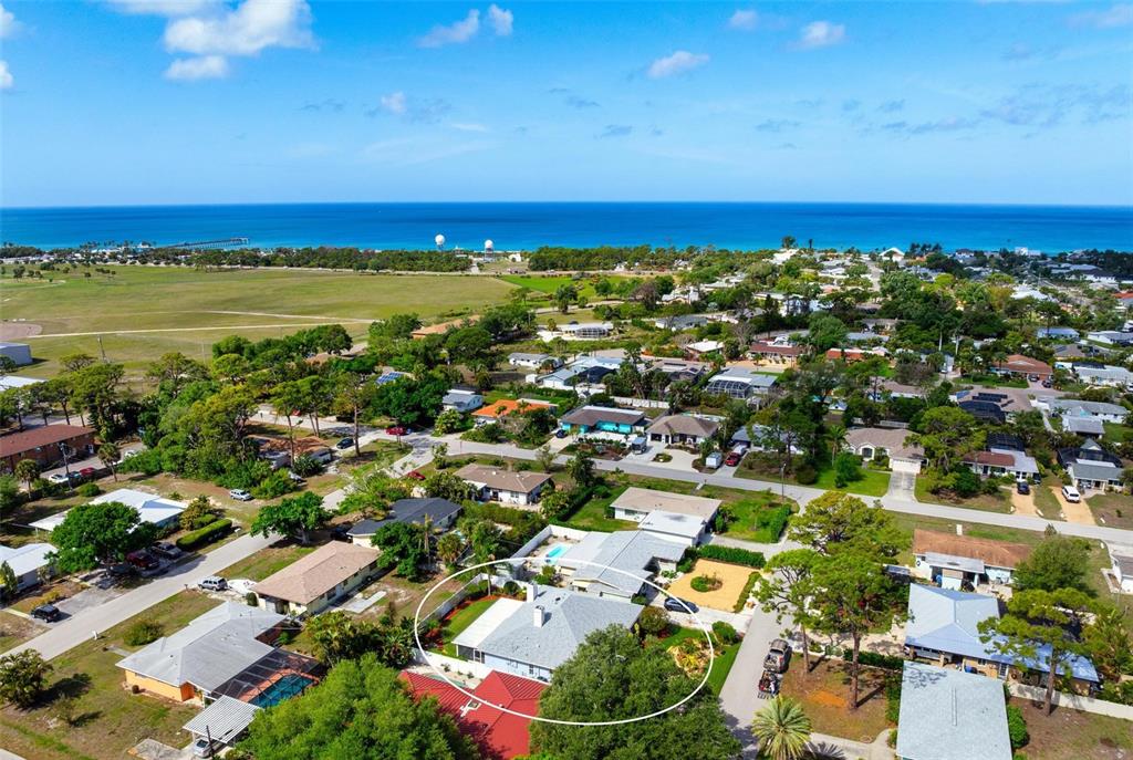 104 Alba Street West Venice, FL 34285 - Photo 41 of 42 an aerial view of residential houses with outdoor space and ocean view