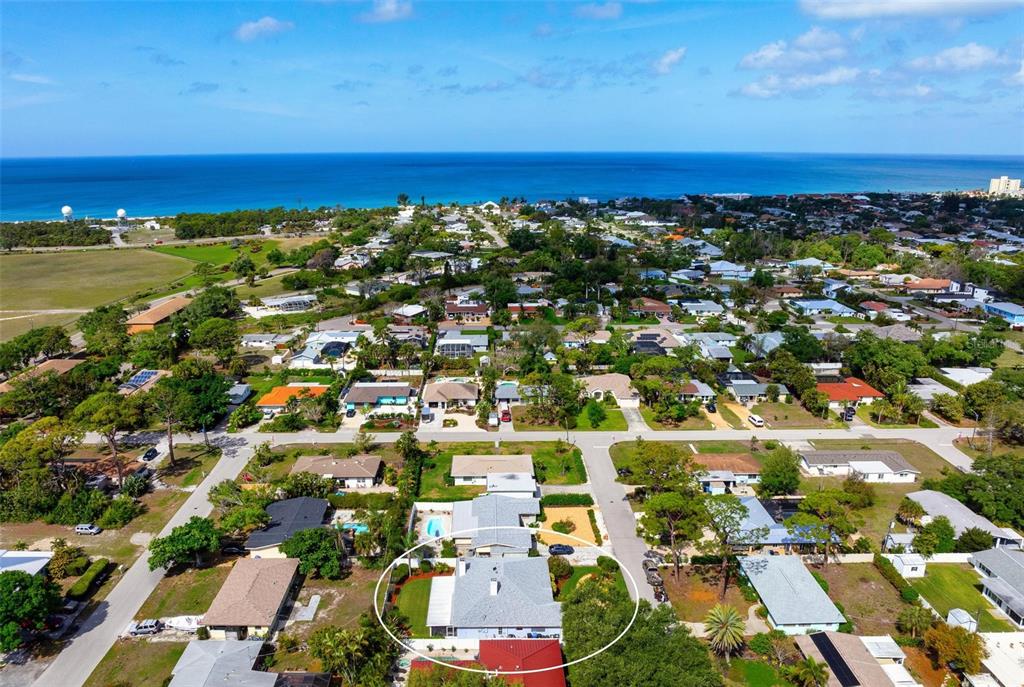 104 Alba Street West Venice, FL 34285 - Photo 42 of 42 an aerial view of residential building and ocean