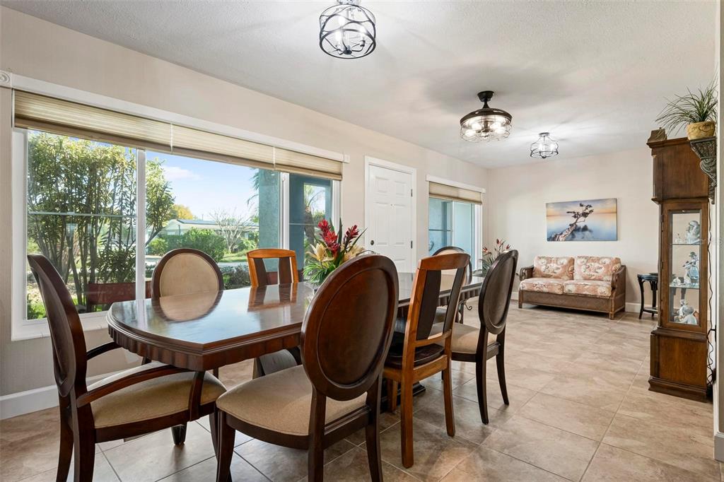 104 Alba Street West Venice, FL 34285 - Photo 8 of 42 a view of a dining room with furniture window and outside view