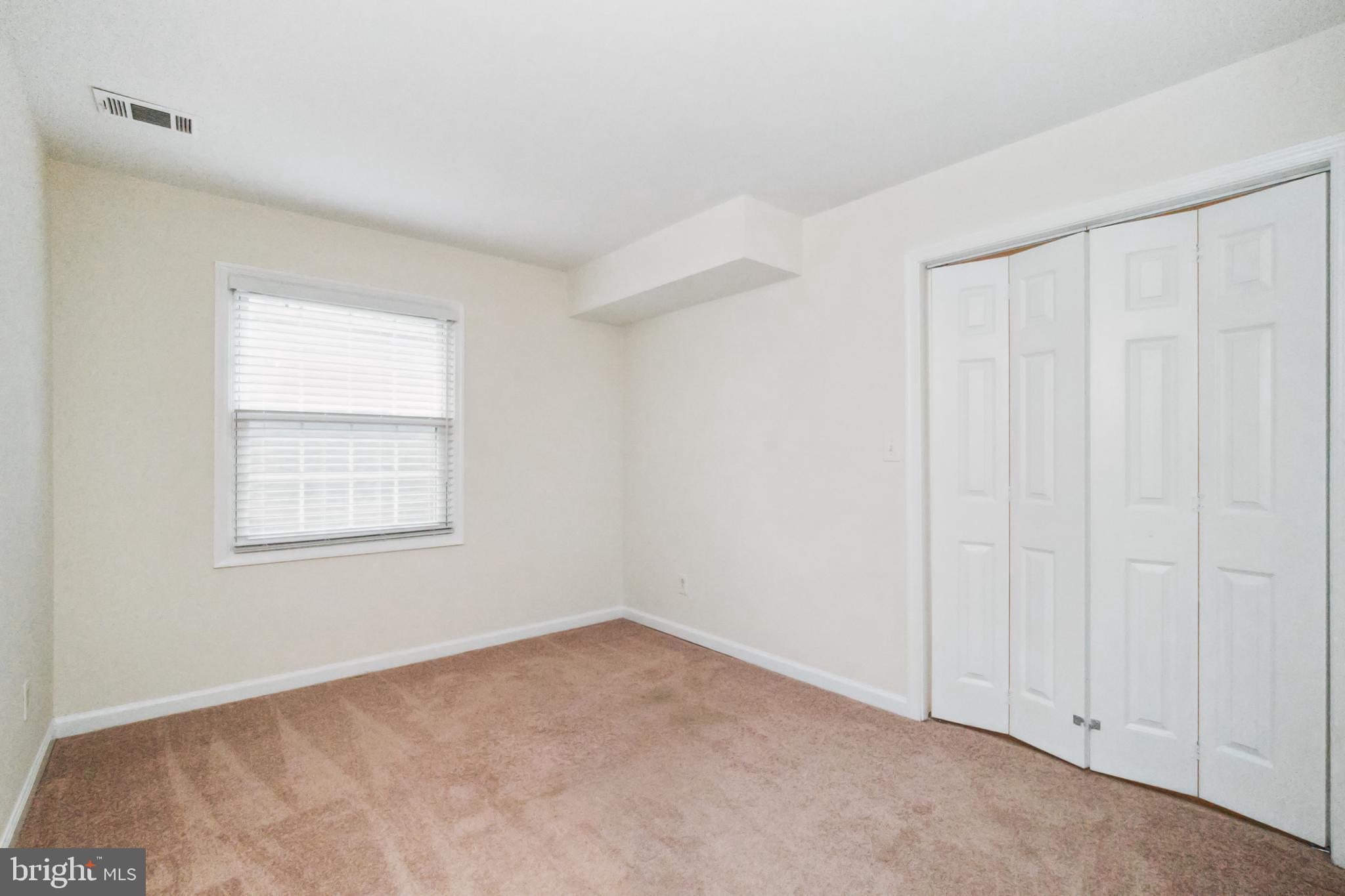8312 Kingsgate Road, Unit 534 Springfield, VA 22152 - Photo 22 of 32 an empty room with windows