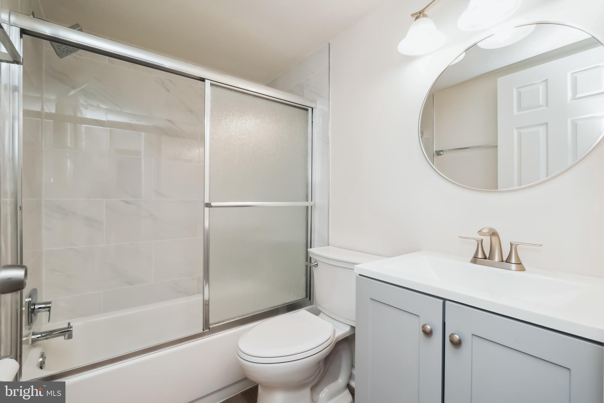 8312 Kingsgate Road, Unit 534 Springfield, VA 22152 - Photo 24 of 32 a bathroom with a sink toilet and shower