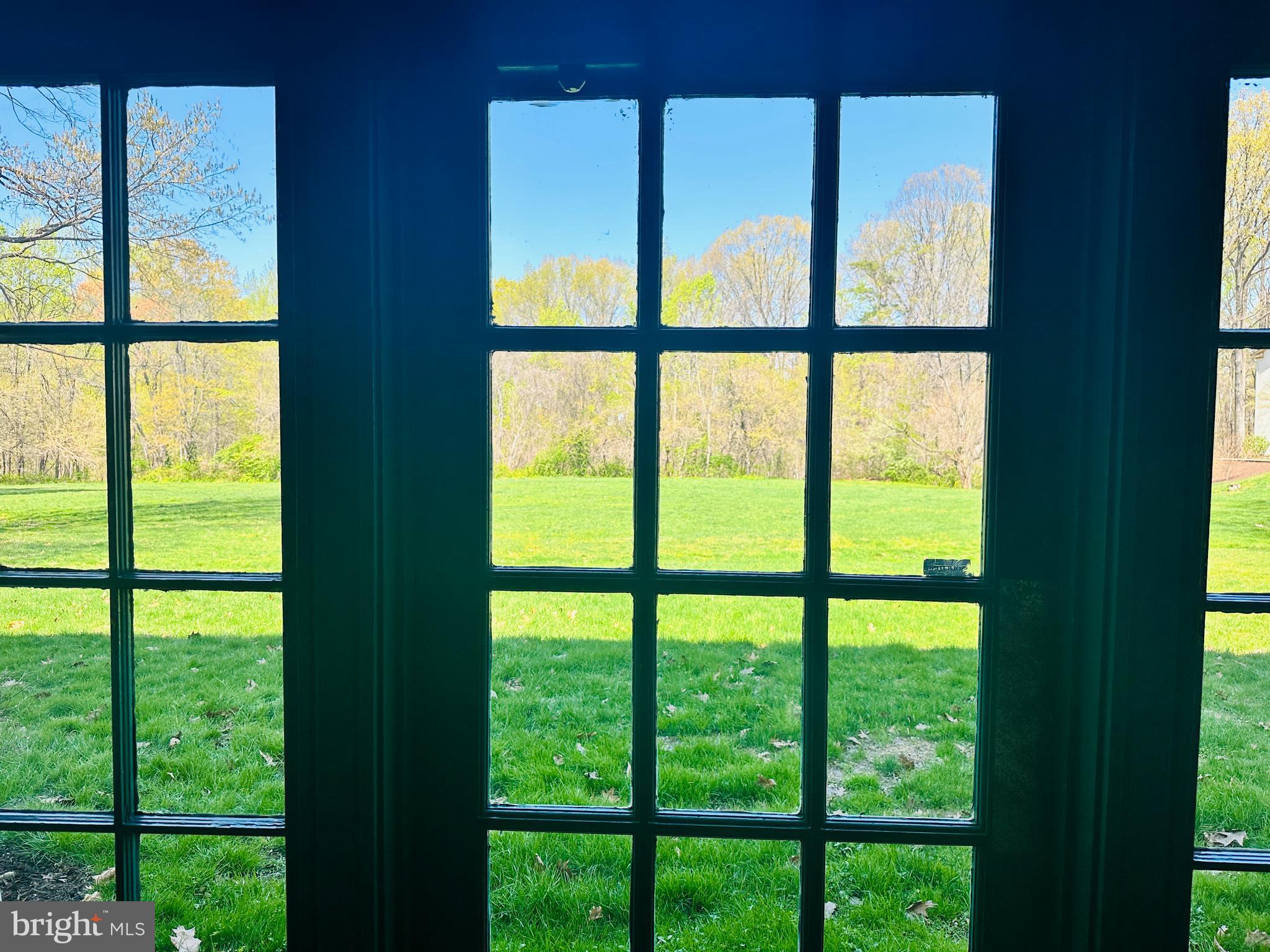 8312 Kingsgate Road, Unit 534 Springfield, VA 22152 - Photo 31 of 32 a view of an empty room with a floor to ceiling window