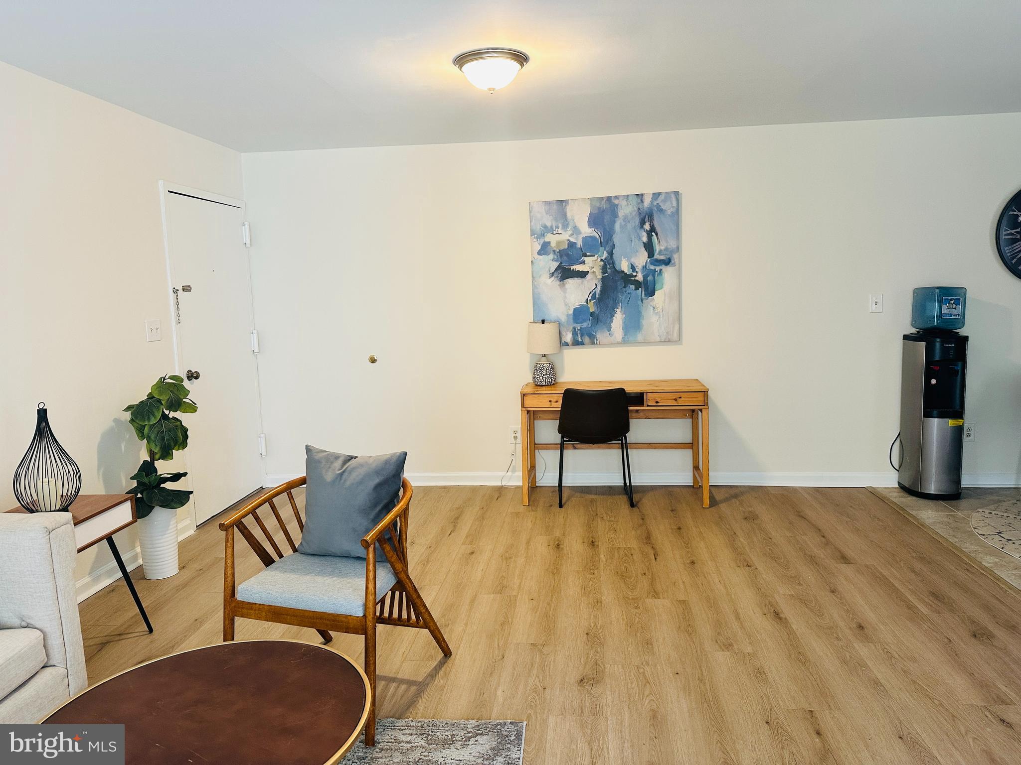 8312 Kingsgate Road, Unit 534 Springfield, VA 22152 - Photo 10 of 32 a view of a livingroom with furniture and wooden floor