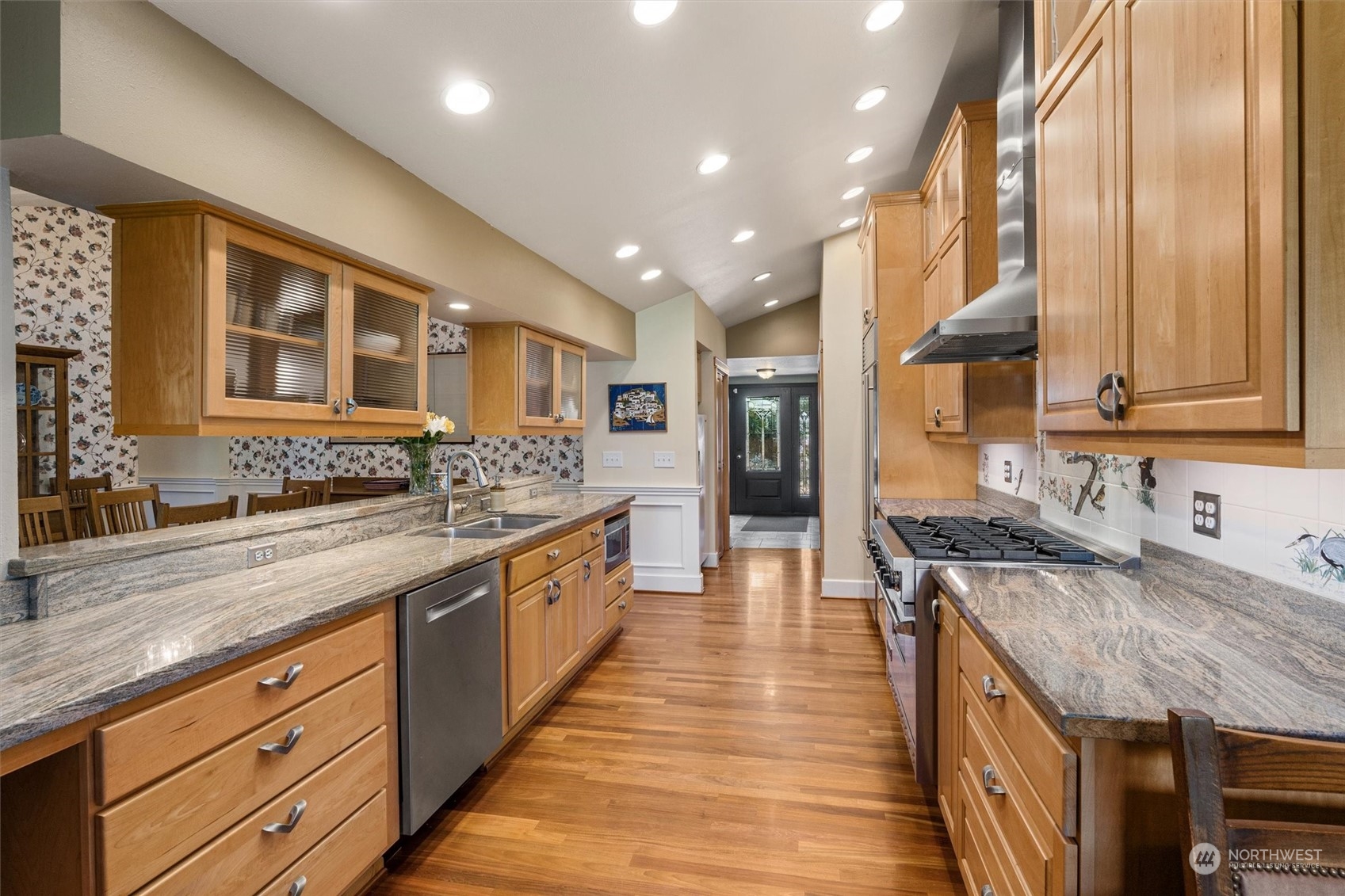 19804 Southeast 150th Street Renton, WA 98059 - Photo 15 of 40 a large kitchen with stainless steel appliances granite countertop plenty wooden cabinets counter space and wooden floor
