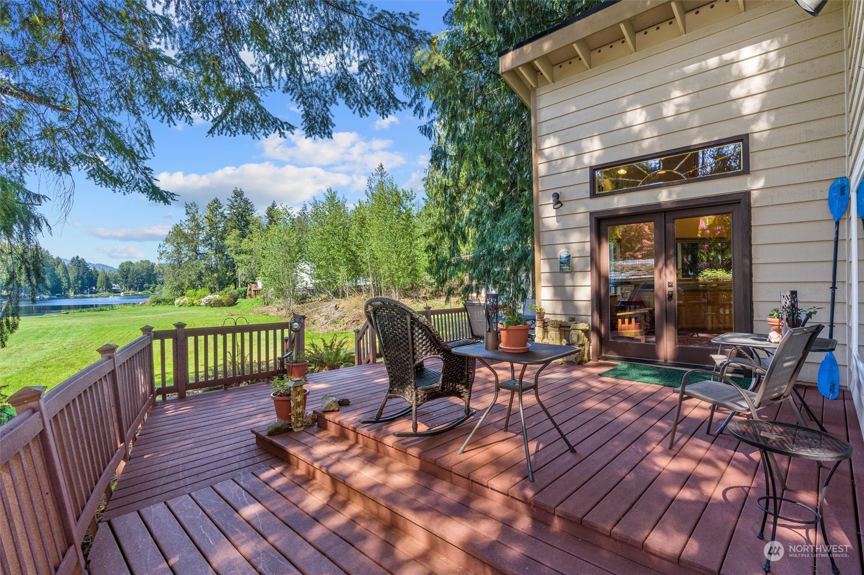 19804 Southeast 150th Street Renton, WA 98059 - Photo 17 of 40 a view of a chair and table on the wooden deck