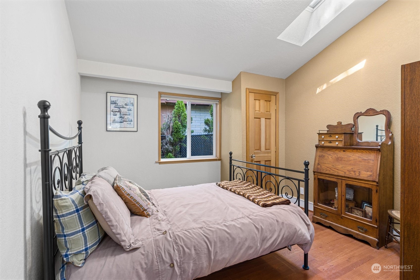 19804 Southeast 150th Street Renton, WA 98059 - Photo 28 of 40 a bedroom with a bed a fireplace with the outer view