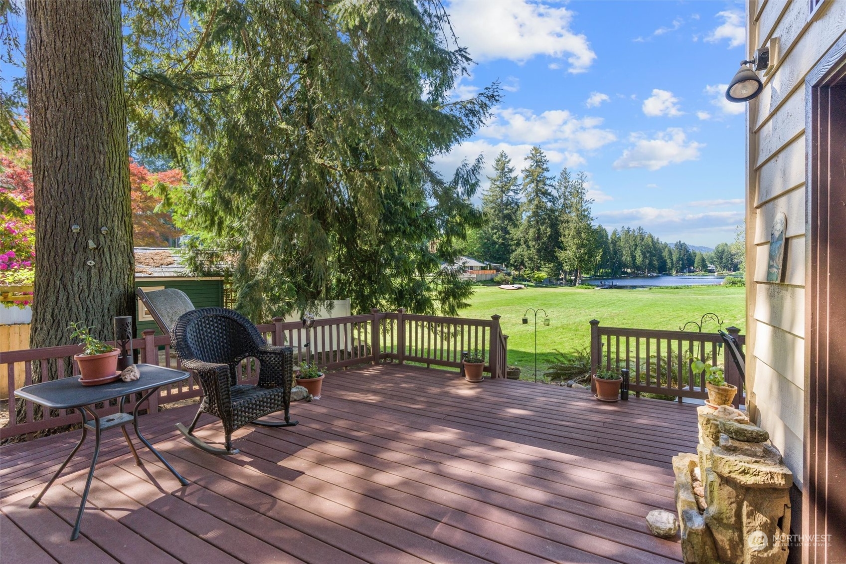 19804 Southeast 150th Street Renton, WA 98059 - Photo 3 of 40 a view of a patio with a table chairs and a table